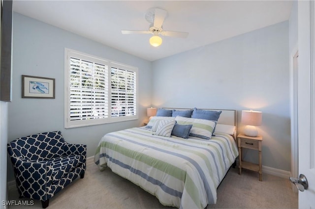 bedroom featuring ceiling fan, carpet floors, and baseboards