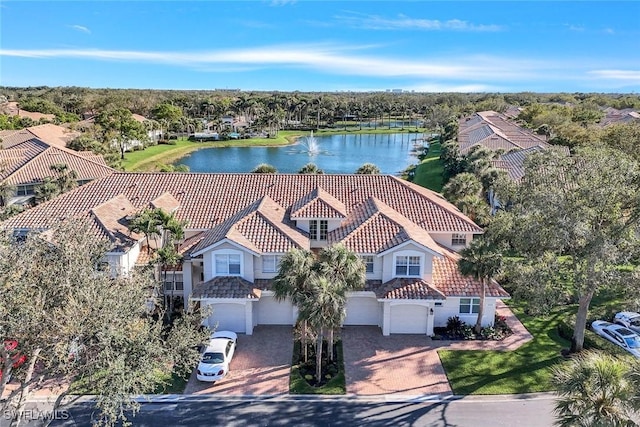 birds eye view of property with a water view