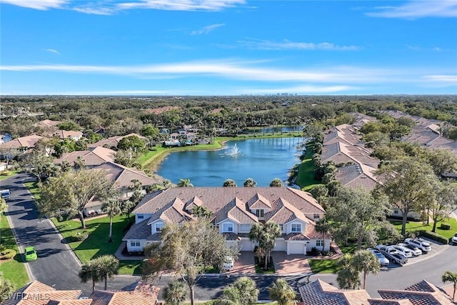 birds eye view of property with a residential view and a water view