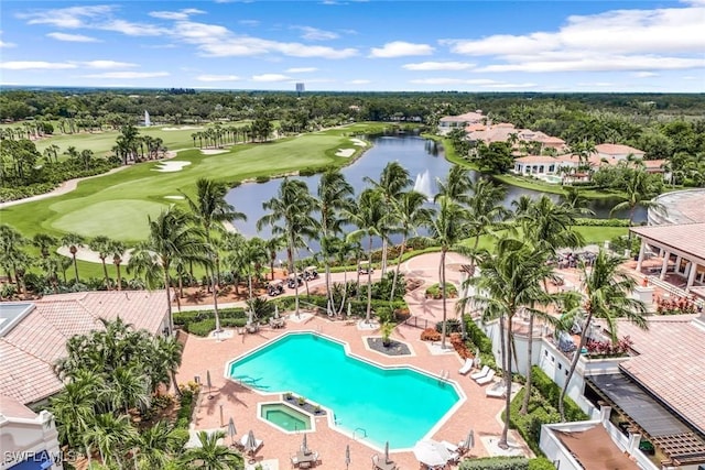 drone / aerial view featuring a water view and golf course view