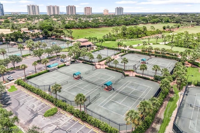 bird's eye view with a city view and golf course view