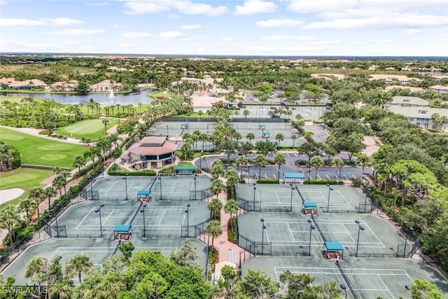 bird's eye view featuring golf course view and a water view