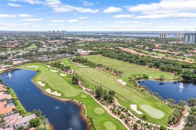 aerial view with view of golf course, a water view, and a view of city