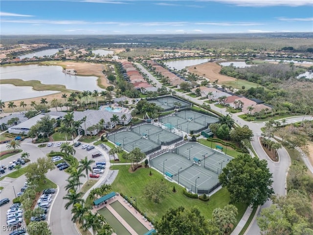 drone / aerial view featuring a residential view and a water view