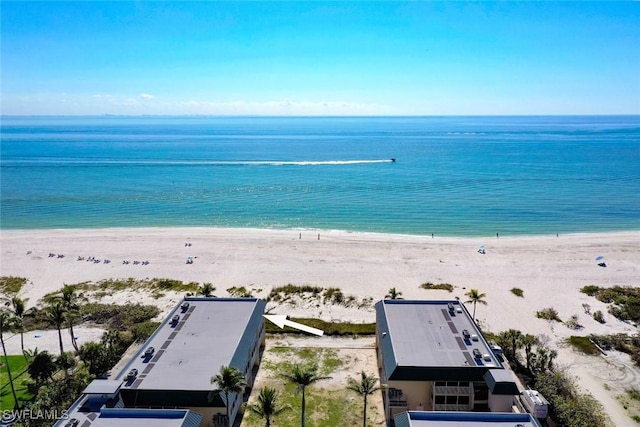 bird's eye view featuring a view of the beach and a water view