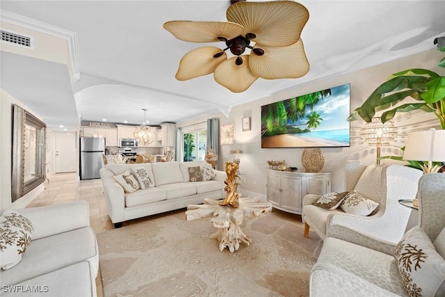 living room with light tile patterned floors, visible vents, and a ceiling fan