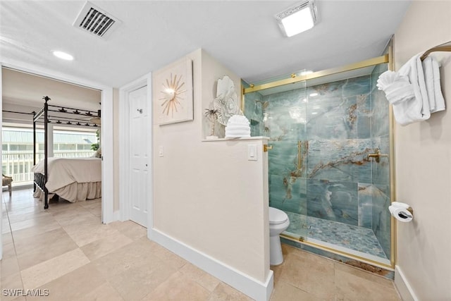 ensuite bathroom featuring a stall shower, baseboards, visible vents, and ensuite bathroom