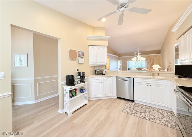 kitchen with light wood finished floors, white cabinetry, appliances with stainless steel finishes, and a sink