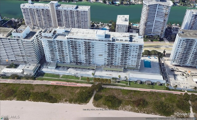 bird's eye view featuring a water view and a view of city