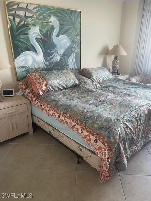 bedroom with light tile patterned floors