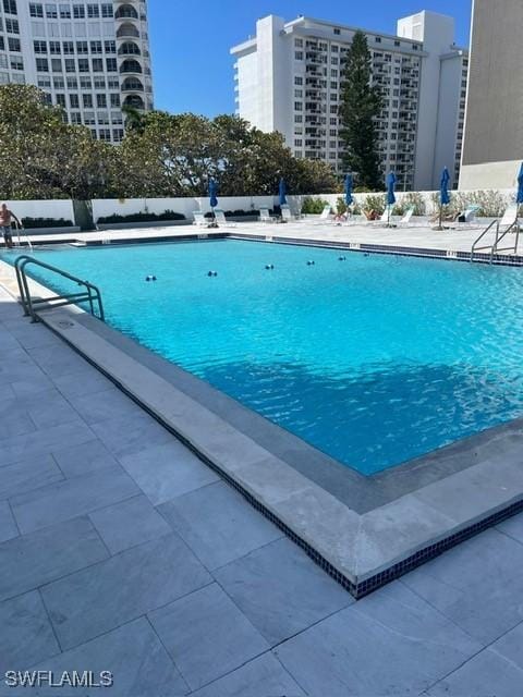 pool with a patio