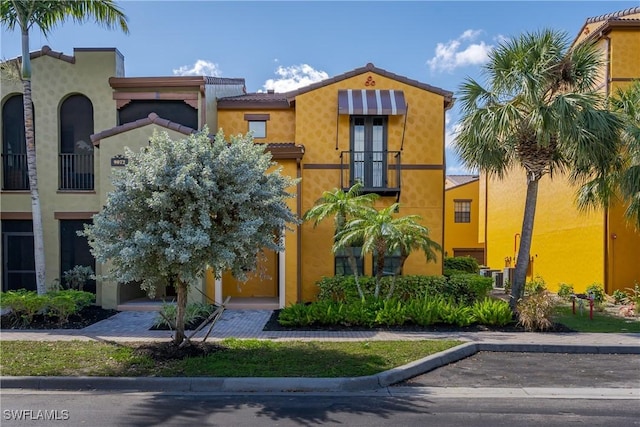 9072 Covina Dr N Unit 5505, Naples, FL 34113 - view of front of home featuring stucco siding and cooling unit