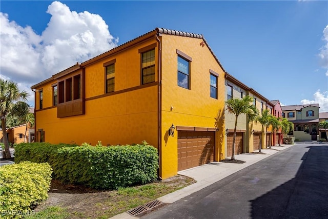 9072 Covina Dr N Unit 5505, Naples, FL 34113 - view of front of house featuring stucco siding
