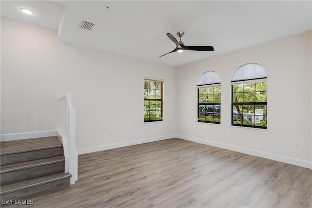 9072 Covina Dr N Unit 5505, Naples, FL 34113 - unfurnished room featuring plenty of natural light, ceiling fan, wood finished floors, baseboards, and recessed lighting