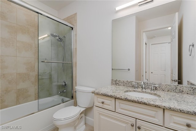 full bathroom with visible vents, toilet, combined bath / shower with glass door, and vanity