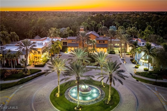 9072 Covina Dr N Unit 5505, Naples, FL 34113 - aerial view at dusk of a forest view