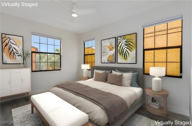 bedroom featuring wood finished floors, baseboards, and ceiling fan