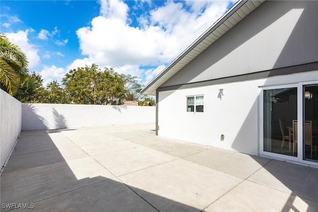 view of patio / terrace featuring fence