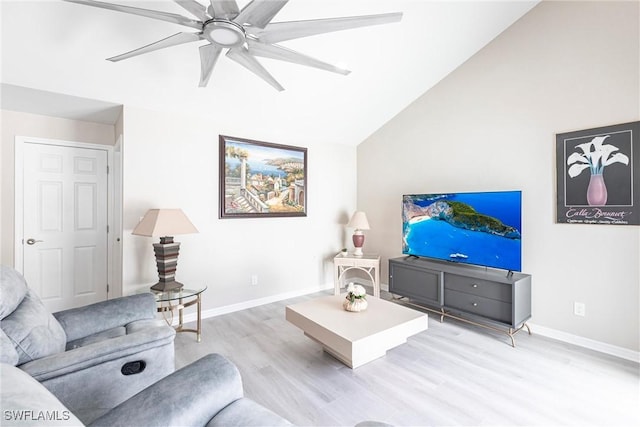 living room with baseboards, lofted ceiling, light wood-style floors, and ceiling fan