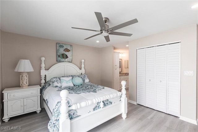 bedroom with light wood finished floors, a closet, a ceiling fan, and baseboards