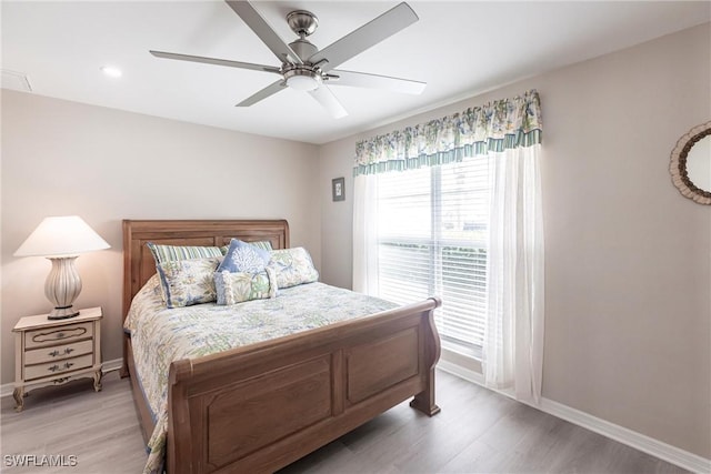 bedroom featuring light wood-type flooring, access to outside, ceiling fan, and baseboards