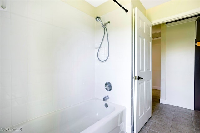 bathroom featuring tile patterned flooring and washtub / shower combination