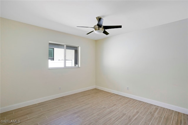 unfurnished room featuring a ceiling fan, baseboards, and wood finish floors