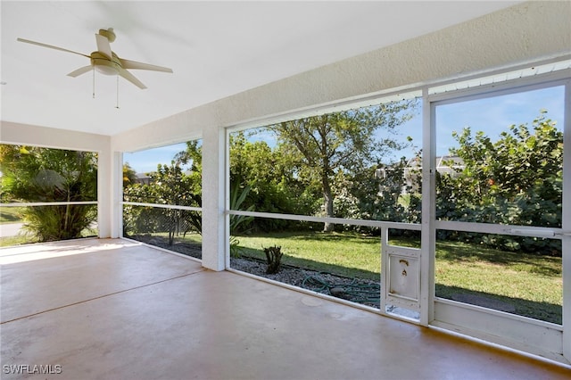 2652 SW 29th Ave, Cape Coral, FL 33914 - unfurnished sunroom featuring a ceiling fan, finished concrete floors, and healthy amount of natural light