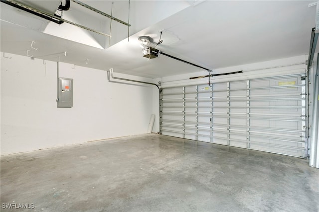 garage featuring electric panel and a garage door opener