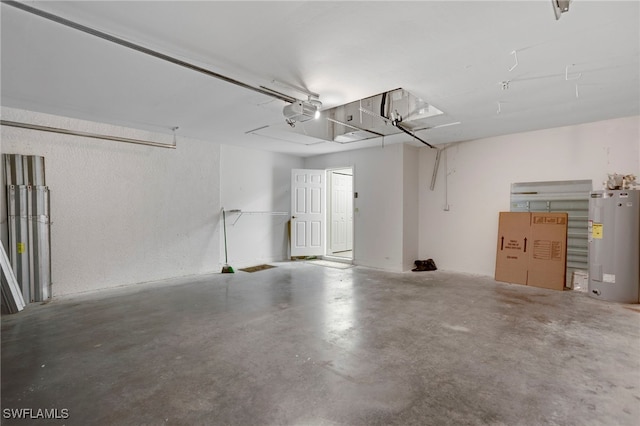 garage with a garage door opener and water heater