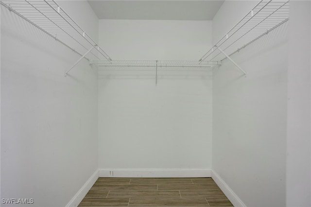 spacious closet with wood tiled floor