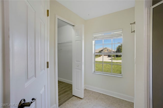 bedroom with baseboards and a closet