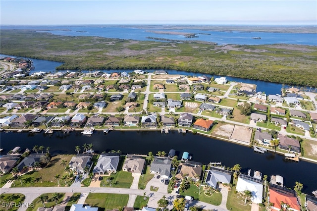 bird's eye view featuring a residential view and a water view