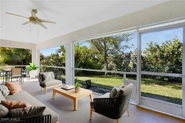 sunroom / solarium featuring ceiling fan