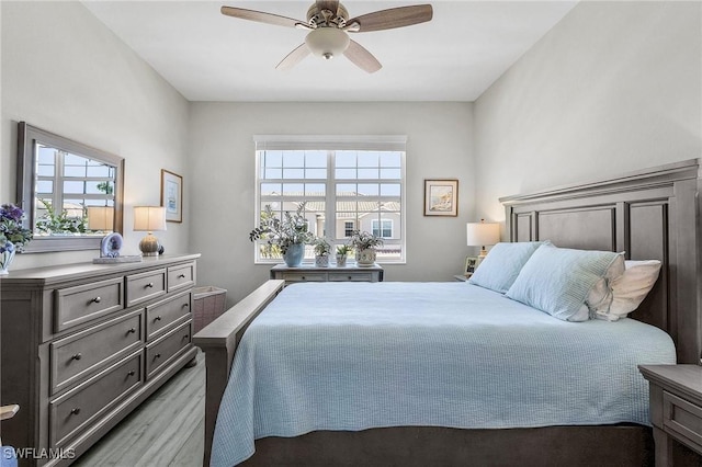 bedroom with light wood-style floors and ceiling fan