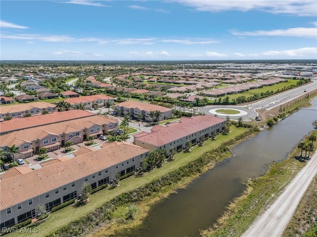 bird's eye view with a residential view and a water view