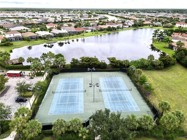 drone / aerial view with a water view and a residential view