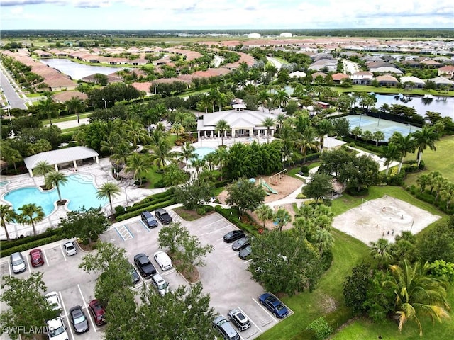 birds eye view of property featuring a residential view and a water view