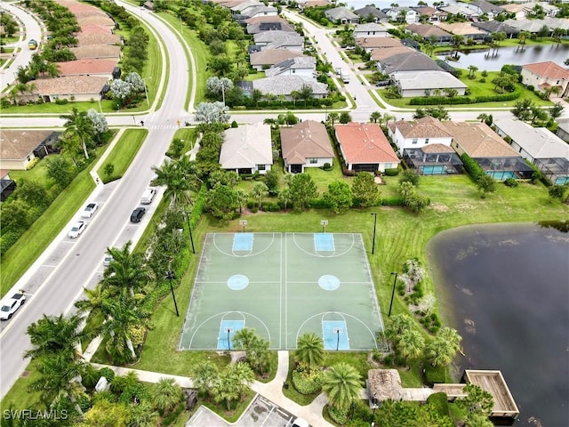 birds eye view of property with a residential view and a water view