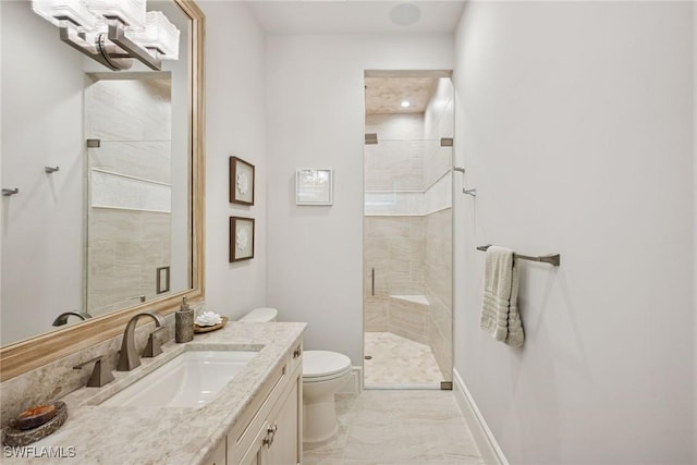 full bathroom with toilet, baseboards, a stall shower, and marble finish floor