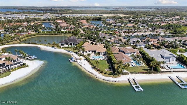 drone / aerial view featuring a residential view and a water view