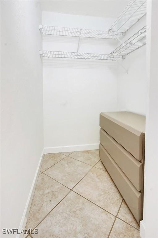 walk in closet featuring light tile patterned floors