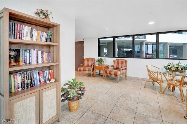 living area with tile patterned flooring