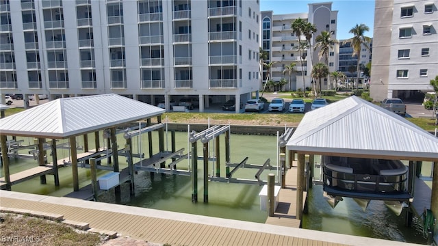 dock area with a water view and boat lift