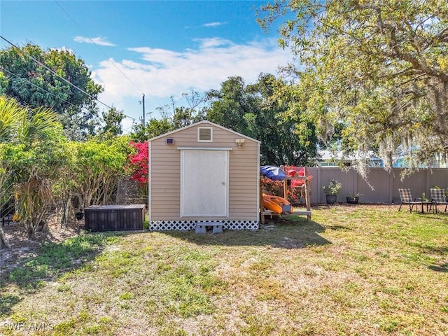 view of shed featuring a fenced backyard