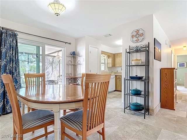 dining area featuring visible vents and baseboards