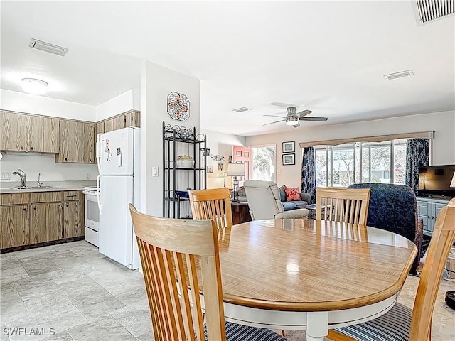 dining area featuring visible vents and ceiling fan