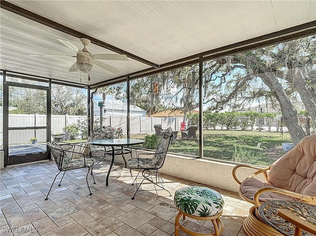 sunroom / solarium with ceiling fan