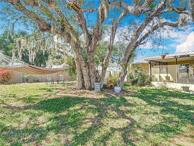 view of yard with a sunroom