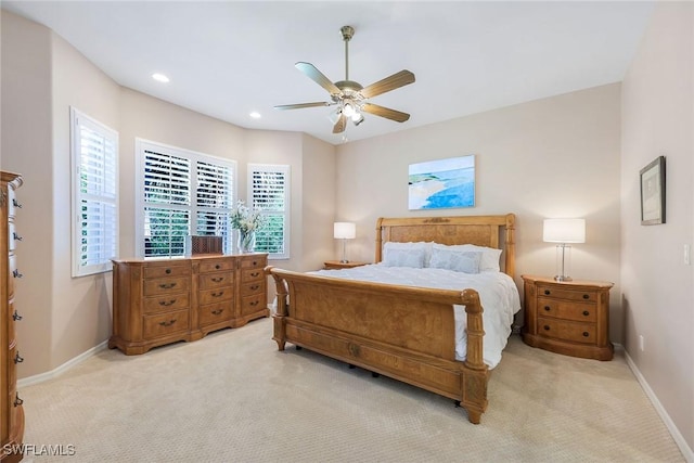 bedroom with recessed lighting, baseboards, light carpet, and a ceiling fan